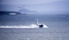 The Scalloway harbour pilot boat brings ashore the rescued crew of the yacht Miracle after being taken off the anchor handling vessel REM Gambler (in the background) which picked them up from a liferaft 50 miles south west of Shetland. Photo Chris Brown