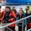 The Polish crew rescued from the yacht Miracle come ashore at Scalloway on Thursday evening, nine hours after escaping their blazing craft. Photo Chris Cope/Shetnews