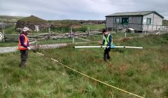 Adam Booth and Jonathan Marsh carrying out electromagnetic surveys at Scatness.