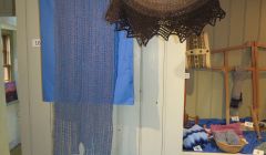 Competition entry No 13, a lacy collar handspun from Jamieson & Smith natural combed Shetland tops, was spun while demonstrating for visitors at Da Böd. Entry No 16, meanwhile, is a lace-effect scarf using Jamieson's spindrift in mirage 722. Photo: Helen Robertson.