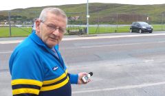 Resident Sandy MacMillan with his decibel measuring device - Photo: Chris Cope/ShetNews