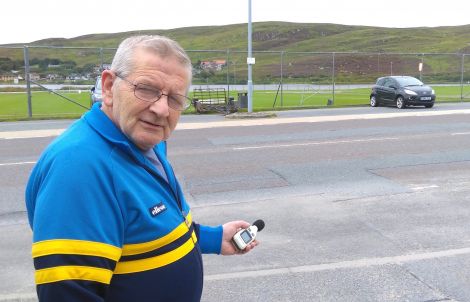 Resident Sandy MacMillan with his decibel measuring device - Photo: Chris Cope/ShetNews