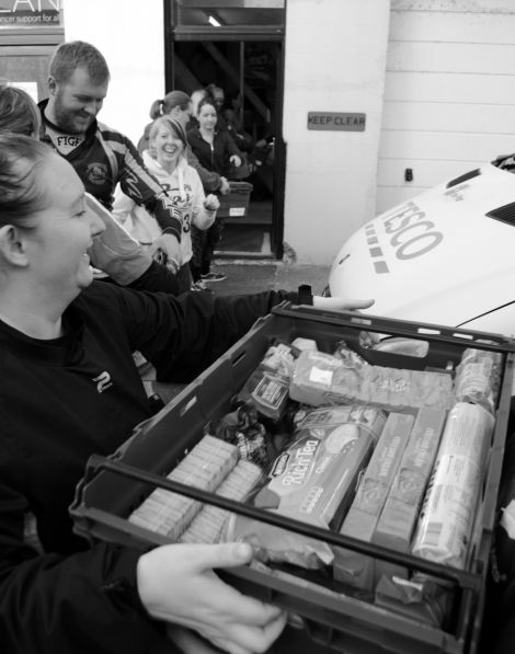 The Shetland rugby team's players helped move 150 crates to the food bank's new premises.