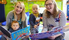 Mums Jody Weaver (left) and Karen Thomason reading to their children Jessi (13 months) and Bobby (11 months) - Photo: Hans J Marter/ShetNews