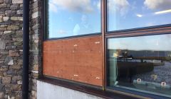 On Friday morning the smashed window was boarded up. Photo: Hans J Marter/ShetNews
