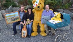 BBC Radio Shetland presenters Daniel Lawson, Jane Moncrieff and John Johnston with Pudsey Bear, the Children in Need mascot.