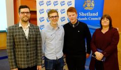 Newly elected MSYPs Sonny Thomason (second from left) and Charlie Haddon (third from left) with Martin Summers of Shetland Islands Council (left) and deputy returning officer Anne Cogle. Photo: SIC.
