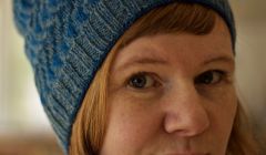 Gudrun Johnston wearing this year's Wool Week hat, her Bousta Beanie.