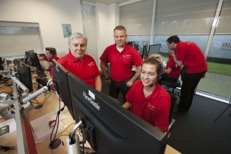 Loganair's operations director Maurice Boyle (left) and managing director Jonathan Hinkles overseeing staff at the airline's new contact centre in Glasgow.