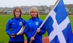 Unst-based track athlete Faye Cox (left) will be the water carrier, and racquet sportswoman Joan Smith will be the flag bearer for Team Shetland in Gotland next month. Photo: Shetland Island Games Association.
