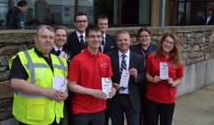 Loganair managing director Jonathan Hinkles (third from right) was in Shetland on Monday in an attempt to counter Flybe's PR offensive as the airlines prepare to go head-to-head from September. Photo: BBC Radio Shetland.