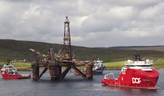 The Buchan Alpha oil installation was towed into Dales Voe on Saturday as owners Repsol Sinopec handed over the 12,000 tonne vessel to Veolia for decommissioning. It could take up to three weeks before the Buchan Alpha is being moved alongside the new quay. Photo: Hans J Marter/Shetland News