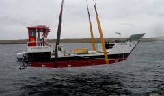 The new Kerrera ferry Carvoria is being lowered into the water at Lerwick harbour. Photo: CMAL