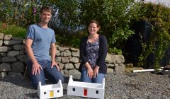 Luke and Kate Holt with two of their distinctive crofthouse planters in Quarff this week. Photo: Shetland News/Neil Riddell.