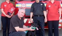 (L-R) Pheona Horne, Angus Mewdell, watch manager John Robertson and Tricia Brown with Teal the dog at the Yell fire station.