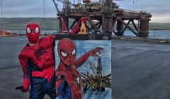 Spiderman safely on land with the painting in front of the Buchan Alpha platform. Photo: Kristof Onhausz