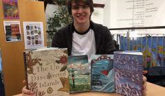 Library assistant Josh Smith with some of the most popular non-fiction books of the year.