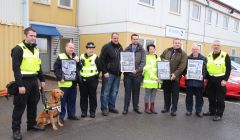 From left to right: Dogs Against Drugs' Ewan Anderson, JBT manager Tony Monaghan, constable Rachel Branney, Northwards' depot manager Robbie Leslie, detective constable Dayne McDonald, Streamline supervisor Lix Boxwell, detective inspector Richard Baird, DFDS director Hamish Balfour and Dogs Against Drugs' Michael Coutts. Photo: BBC Radio Shetland