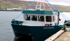 The Vaila Marie sporting Canadian flags in honour of Cooke Aquaculture's roots. Photos: Chris Cope/Shetland News