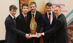 Left to Right: Shetland Gift Company members Scott Smith, Jack Irvine, Cameron Andrews, Michael Jamieson with local MSP Tavish Scott who presented the award. Photo: Stewart Hornal