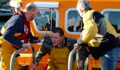 A crewman leaving the lifeboat in Lerwick. Photo: Chris Cope/Shetland News