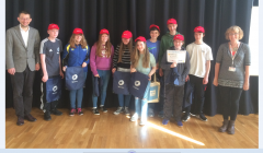 The winning pupils from Mid Yell Junior School receive their prizes from Thomas Chaurin, education attaché of the French embassy in the UK, and Jenny Wink, Shetland Gas Plant facilities management co-ordinator.