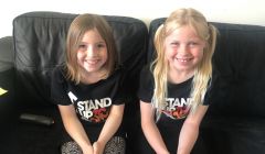 Proud as punch: A beaming Leah (left) and Missy (right) after their bake sale.
