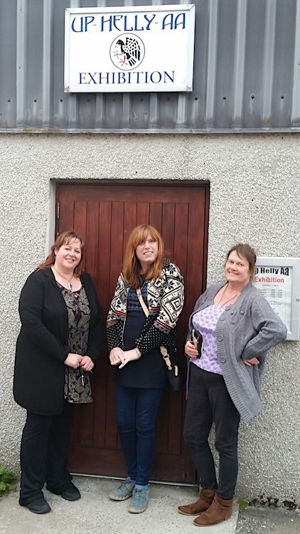 Campaigners Karrol Scott, Zara Pennington and Debra Nicolson at the Lerwick Up helly Aa galley shed on Saturday.
