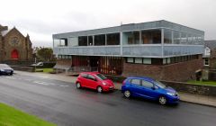 The old library building with the current library, in the former St Ringan's church, on the left. Photo: Chris Cope