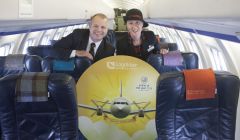 Managing director of Loganair Jonathan Hinkles and cabin crew member Sharon Williams showing off their gold award.