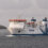A large ferry named "NorthLink" sails in open water, with a lighthouse visible in the background. © Austin Taylor Photography, 2023.