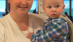 A woman holding a baby.