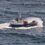 A boat in the middle of the ocean.