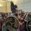 A group of people dressed as vikings in a room.