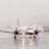 A small plane on a wet runway.