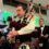 Two men playing bagpipes at a party.