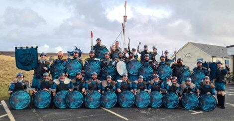 A group of vikings posing for a photo.