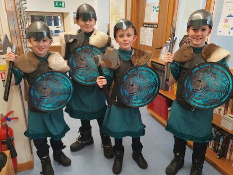 A group of children wearing clothing.