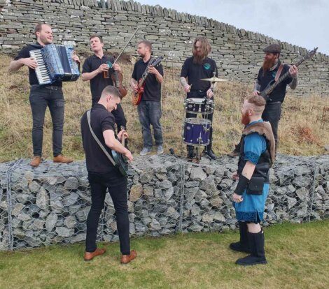 A group of men playing instruments.