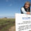 A person leans on a sign at SaxaVord UK Spaceport, which announces it as Europe's first licensed vertical launch facility, opened on May 29, 2024.