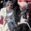 Two elderly women sit and talk outdoors. One holds a Norwegian flag and wears a cream shawl, while the other wears a black jacket with a red, white, and blue ribbon.