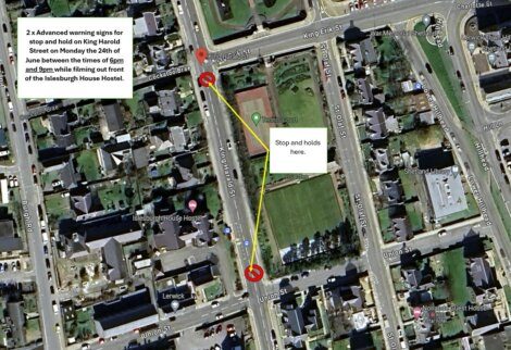 Aerial map showing King Harald Street in Lerwick with markers indicating two advanced warning signs for stop and hold on June 26th between 1pm and 3pm during filming in front of Islesburgh House Hostel.