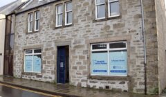 Street view of a stone building with windows displaying signage for "Lerwick Dental Practice" located at 4 Market Street.