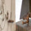 Left: Hanging wire and stone art installation. Right: Two antique saws with ornate handles displayed on a wooden base.
