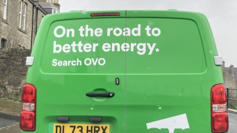 Green van with the text "On the road to better energy. Search OVO" on the back. License plate number: DL73HRX.