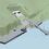 A digital rendering of a waterfront facility with a dock, ramps, buildings, and adjacent sloped terrain leading into the water.