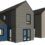 3D rendering of three modern, narrow two-story houses with gabled roofs and varying exterior colors, including blue, gray, and beige.