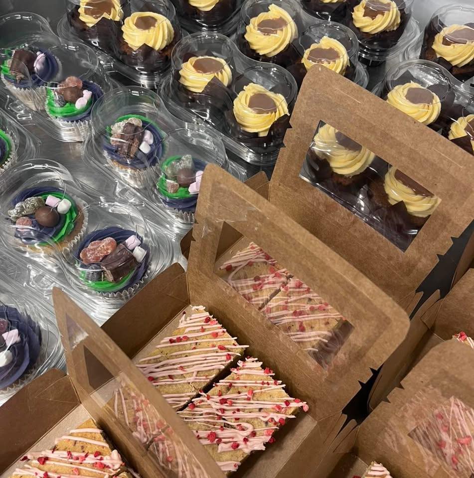 A group of cupcakes in boxes.